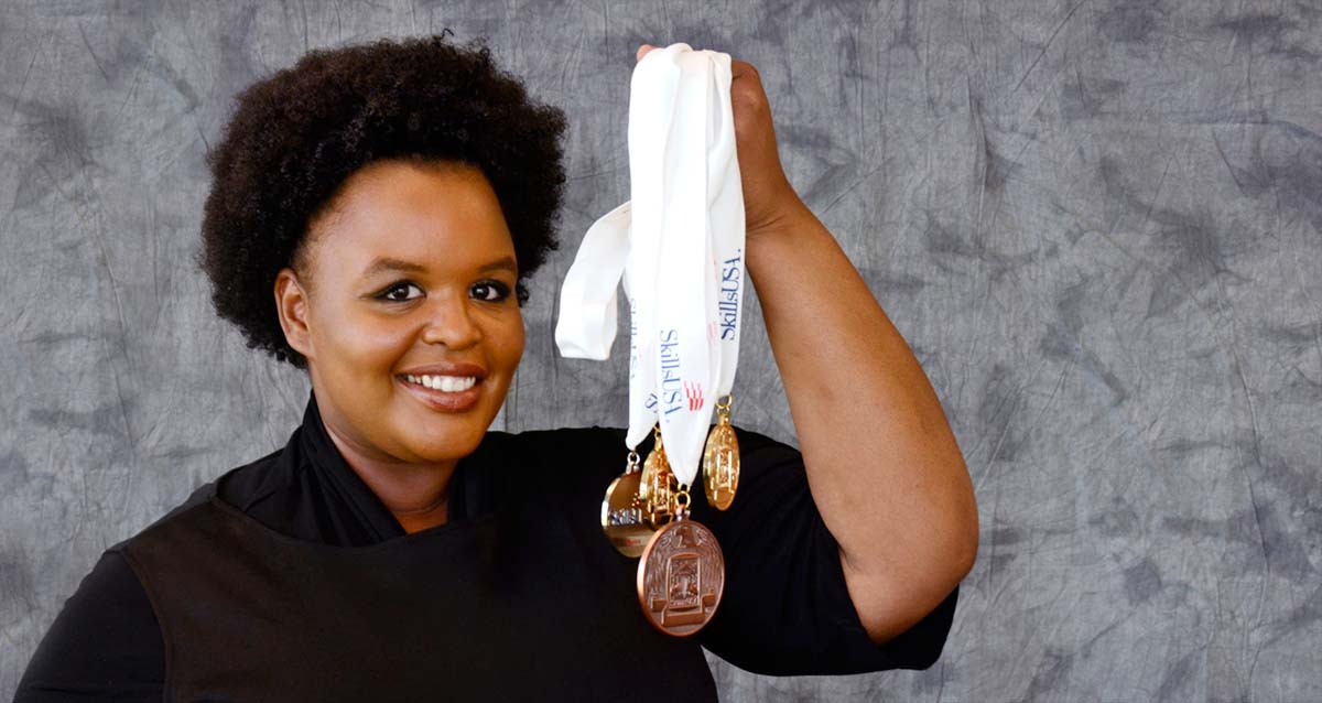 image of skillsusa medalist april walker holding up her medals