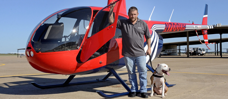 Texas State Technical College Student Veteran boarding helicopter with dog image
